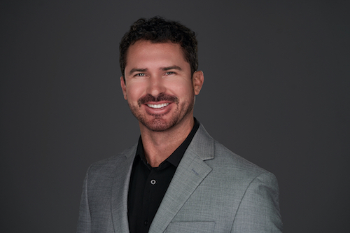 Walker Martin, a real estate agent with LoKation Real Estate, in a gray blazer.